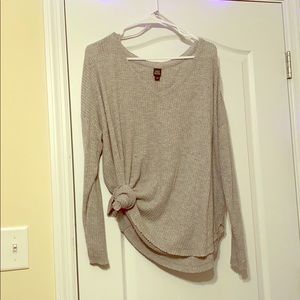 A light gray sweater